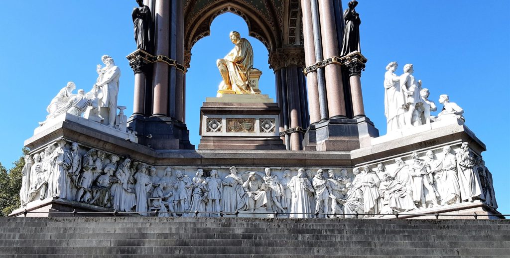 a large stone statue in front of a building
