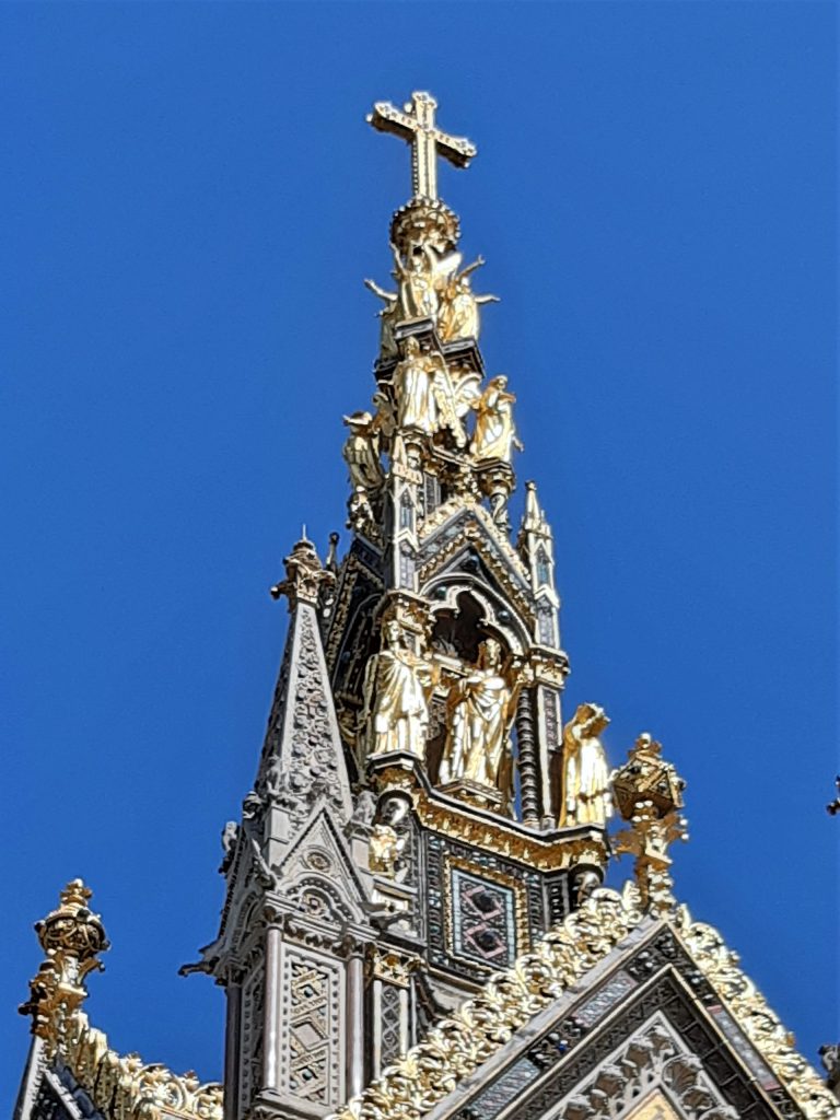 a large tall tower with a clock at the top of a building