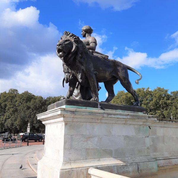 a statue of a man jumping in the air