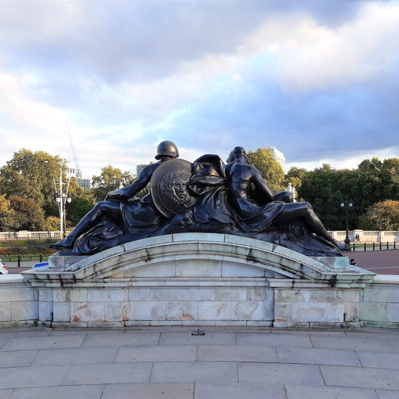 a statue in front of a building