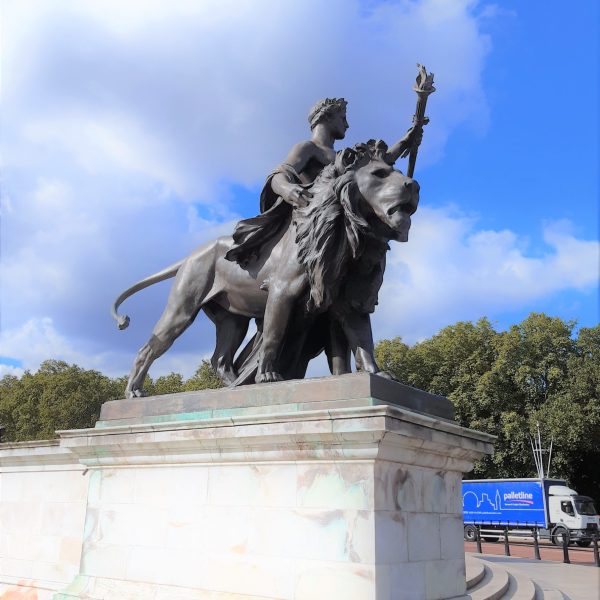 a statue of a person jumping in the air