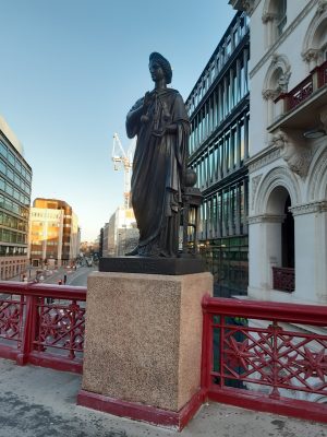 a statue of a stone building